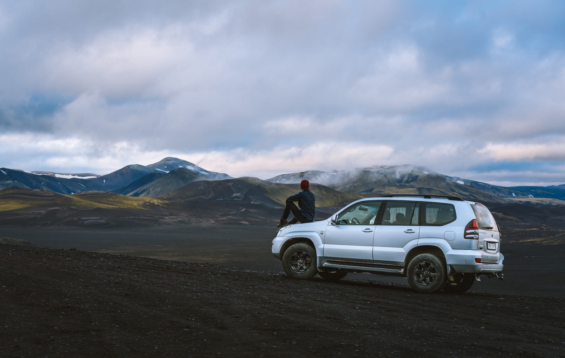 Conventional powertrain SUV parked in the mountains