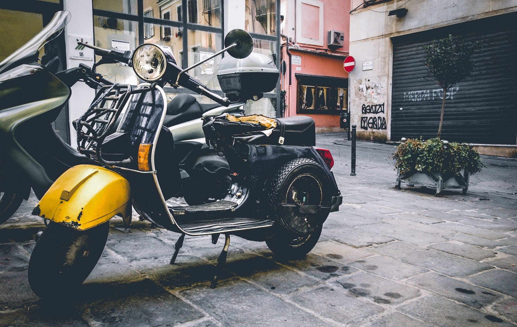 Yellow two wheeler moped scooter